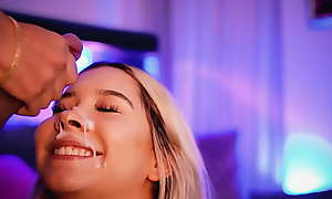 Blonde with a beautiful face sucks her friend's cock while transmitting and receives a big load of cum on her face