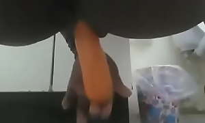Sexy Babe squirts while using a carrot.