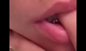 Jaidah Quinn sucking on her finger to preview her head skill with lips and tongue.